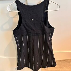 Lululemon on black tank. I believe be this is a 6 or 8 but can’t find the size.